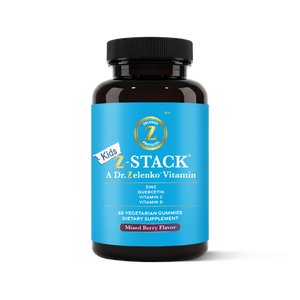 Bottle of Kids Z-Stack vitamins with blue label and black cap on white background