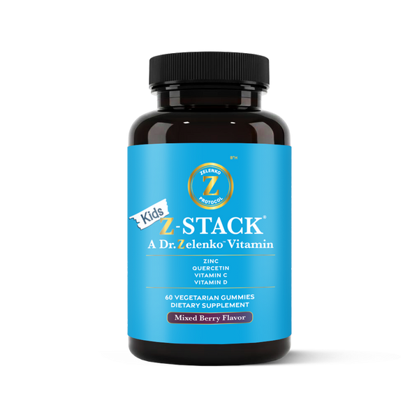 Bottle of Kids Z-Stack vitamins with blue label and black cap on white background