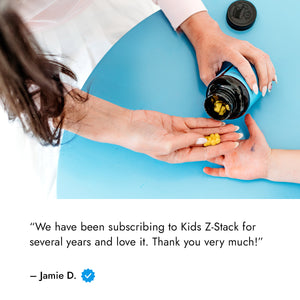 Kids Z-Stack review with image of woman's hands handing gummies to child